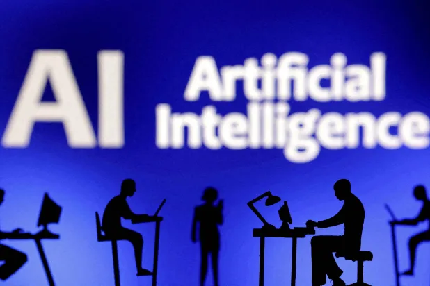 FILE PHOTO: Figurines with computers and smartphones are seen in front of the words "Artificial Intelligence AI" in this illustration created on February 19, 2024. REUTERS/Dado Ruvic/Illustration/File Photo