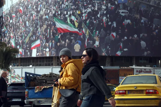 Iranians walk in a street in Tehran, Iran, 02 February 2026. (EPA)