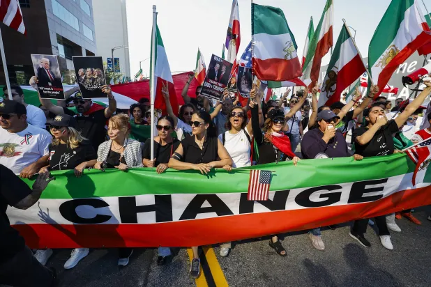 Demonstrators wave flags and march in celebration following the US and Israeli strikes in Iran; in Los Angeles, California, USA, 28 February 2026. (EPA)