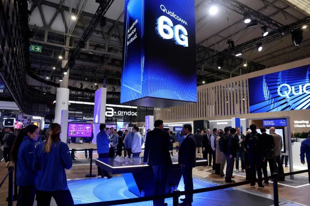 A picture taken on March 2, 2026 in Barcelona shows Qualcomm's stand adverstising 6G technology during the inauguration of the Mobile World Congress (MWC), the world's biggest mobile technology showcase and fair. (Photo by Josep LAGO / AFP)