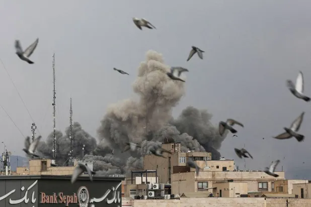 Birds fly as smoke rises following an explosion, after Israel and the US launched strikes on Iran, amid the US-Israel conflict with Iran, in Tehran, Iran, March 2, 2026. Majid Asgaripour/WANA (West Asia News Agency) via Reuters