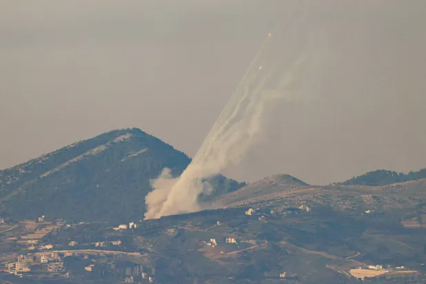 A picture taken along the Israel-Lebanon border shows rockets being fired from southern Lebanon towards Israel on March 3, 2026. (AFP)