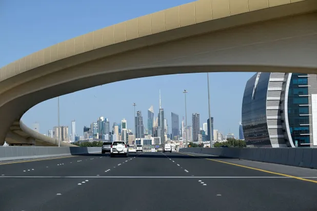 Vehicles drive along the highway leading to and from Kuwait City on March 2, 2026. (Photo by YASSER AL-ZAYYAT / AFP)