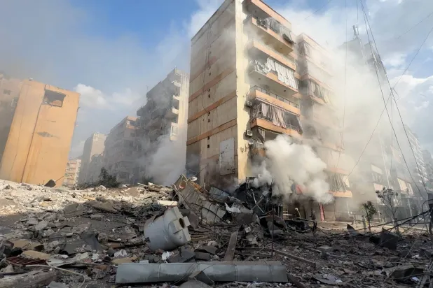 Smoke rises from a building damaged during strikes, following an escalation between Hezbollah and Israel, amid the US-Israeli conflict with Iran, in Beirut, Lebanon March 4, 2026, in this screengrab obtained from a social media video. Obtained By Reuters/via Reuters