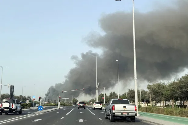 FILE PHOTO: Smoke billows from Zayed port after an Iranian attack in Abu Dhabi, United Arab Emirates, March 1, 2026. REUTERS/Abdelhadi Ramahi/File Photo