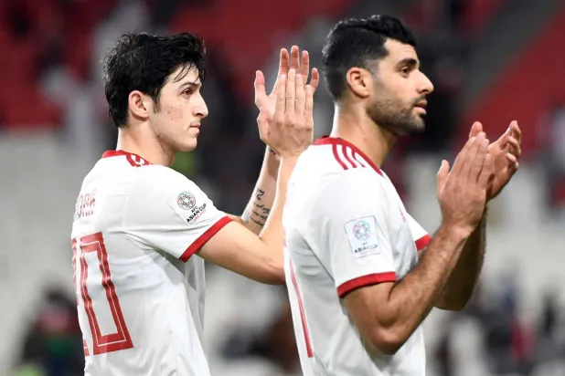 سردار أزمون ومهدي تاريمي (رويترز)