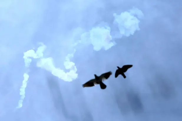 Smoke from intercepted missiles appears in the sky over Doha (EPA). 