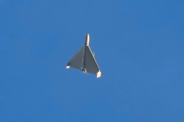 An Iranian Shahed exploding drone launched by Russia flies through the sky seconds before it struck buildings in Kyiv, Ukraine, on Oct. 17, 2022. (AP)