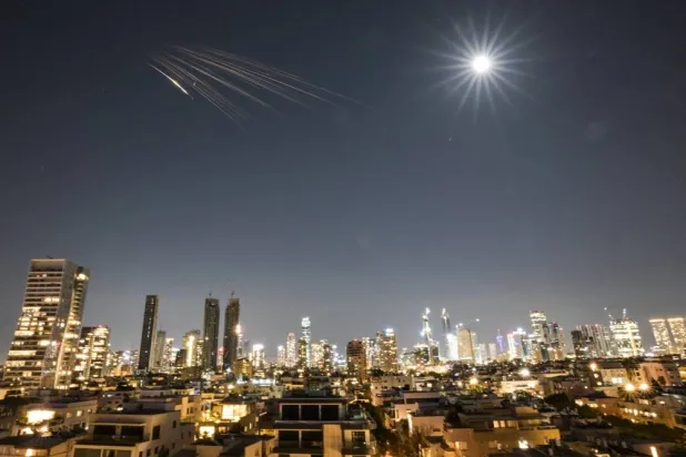 An Iranian missile with cluster munitions flies towards Israel, amid the US-Israeli conflict with Iran, in central Israel, March 5, 2026. (Reuters)
