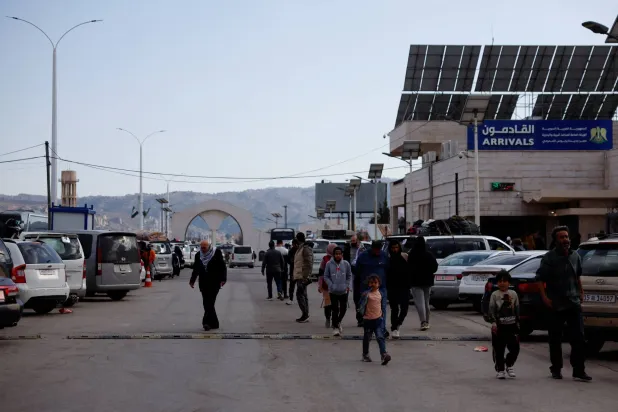  Syrians living in Lebanon wait outside the Ministry of Interior Immigration and Passports Department, at the Syrian-Lebanese border, as they return to Syria due to ongoing hostilities between Hezbollah and Israeli forces, amid the US-Israeli conflict with Iran, in Jdaydet Yabous, Syria, March 3, 2026. (Reuters)