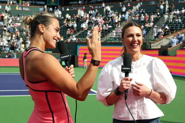 Aryna Sabalenka of Belarus shows off her engagement ring during an interview with Joanna Sakowicz Kostecka after a match against Himeno Sakatsume of Japan during Day 3 of the BNP Paribas Open at Indian Wells Tennis Garden on March 06, 2026 in Indian Wells, California. (Getty Images/AFP)