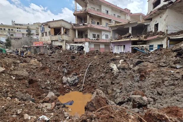 A huge crater left by an Israeli airstrike in the village of Nabi Sheet, eastern Lebanon late Friday, March 6, 2026. (AP Photo/Ali Salem)