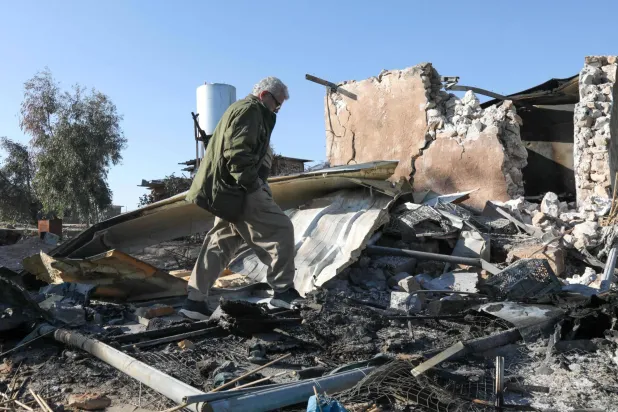 An Iranian Kurdish Peshmerga member of the Kurdistan Democratic Party of Iran (KDPI) inspects the damage sustained at the Azadi Camp of the Kurdistan Democratic Party of Iran (KDPI) following an Iranian cross-border attack in the town of Koye (Koysinjaq), in the east of Erbil district in the autonomous Kurdish region of northern Iraq on March 3, 2026. (Photo by Safin HAMID / AFP)
