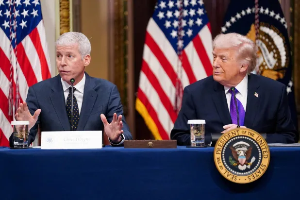 FILE PHOTO: US President Donald Trump and Secretary of Energy Chris Wright attend a roundtable on the Ratepayer Protection Pledge in the Indian Treaty Room in the Eisenhower Executive Office Building on the White House campus in Washington, D.C., US, March 4, 2026. REUTERS/Nathan Howard/File Photo