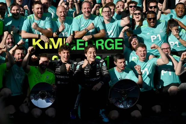 Kimi Antonelli (C-L) and George Russell (C-R) of Mercedes celebrate with the pit crew and team following the 2026 Australian Grand Prix at Albert Park Circuit in Melbourne, Australia, 08 March 2026. (EPA)