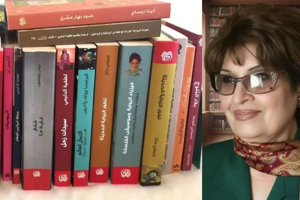 لطفية الدليمي مع أغلفة بعض كتبها