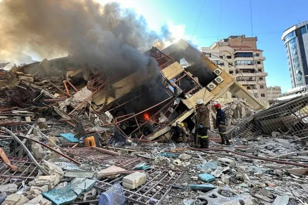 Members of the Lebanese Civil Defense inspect a damaged building after an Israeli strike on Beirut's southern suburbs, following renewed hostilities between Hezbollah and Israel amid the US-Israeli conflict with Iran, Lebanon, March 9, 2026. (Reuters)