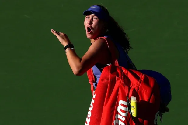 Mirra Andreeva reacts to the crowd as she leaves the court after her loss to Katerina Siniakova of Czechia during Day 6 of the BNP Paribas Open at the Indian Wells Tennis Garden on March 09, 2026 in Indian Wells, California. (Getty Images/AFP)