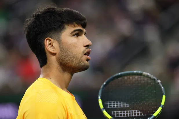 Carlos Alcaraz of Spain between serves against Arthur Rinderknech of France in their third round match of the BNP Paribas Open at Indian Wells Tennis Garden on March 09, 2026 in Indian Wells, California. (Getty Images/AFP)