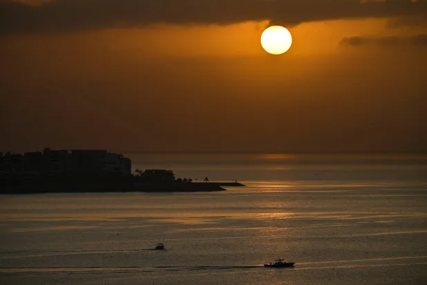 The sun rises over Panama Bay in Panama City on March 7, 2026. (AFP)