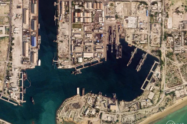  This handout satellite image taken by 2026 Planet Labs PBC shows damage at the military harbour in Iran's southern port of Bandar Abbas along the Strait of Hormuz on March 4, 2026.  (Photo by 2026 Planet Labs PBC / AFP) 