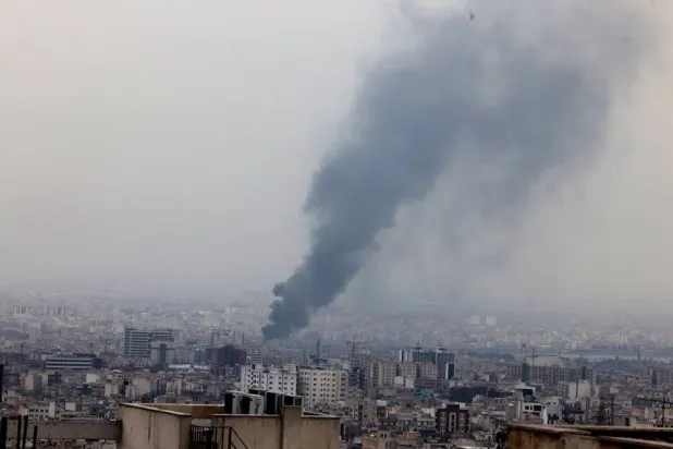 Smoke rises after an air strike in central Tehran, Iran, 10 March 2026. (EPA)