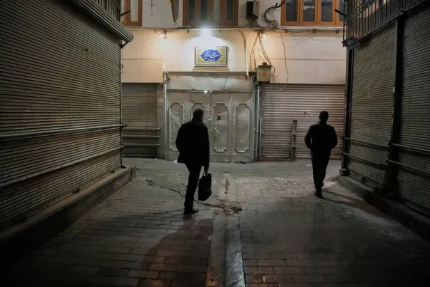  People walk past closed shops at the nearly empty Tajrish traditional bazaar in northern Tehran, Iran, Tuesday, March 10, 2026. (AP)