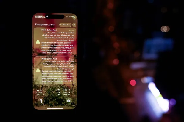 An alert issued by the United Arab Emirates' Interior Ministry, warning of potential missile threats and instructing to seek shelter, is displayed on a mobile phone, in Dubai, United Arab Emirates, March 11, 2026. REUTERS/Amr Alfiky
