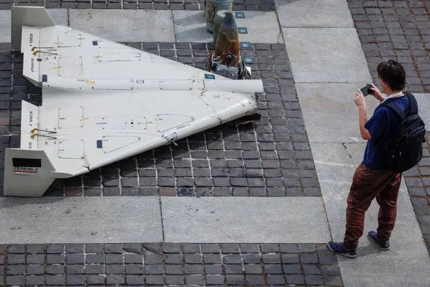 A visitor of an exhibition takes a photo of parts of an Iranian made unmanned aerial vehicle (UAV) Shahed-131/136, which was launched on Ukrainian territories, amid Russia's attack on Ukraine, in Kyiv, Ukraine June 27, 2025. (Reuters)