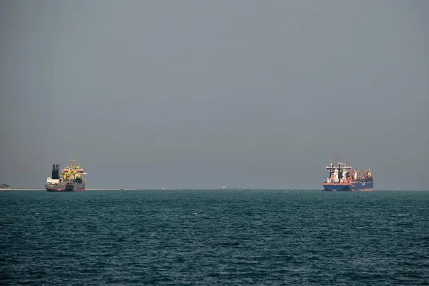 Commercial vessels are pictured offshore in Dubai on March 11, 2026. (AFP)