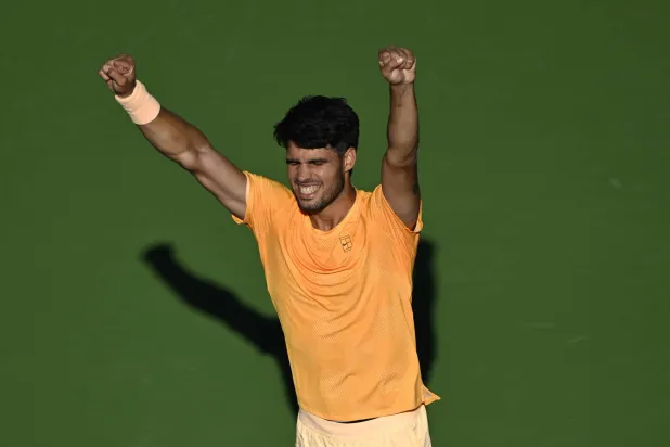 11 March 2026, US, Indian Wells: Spanish tennis player Carlos Alcaraz celebrates defeating Norway's Casper Ruud during their men's singles round of 16 match at the BNP Paribas Open held at the Indian Wells Tennis Garden in Indian Wells. Photo: Charles Baus/CSM via ZUMA Press Wire/dpa