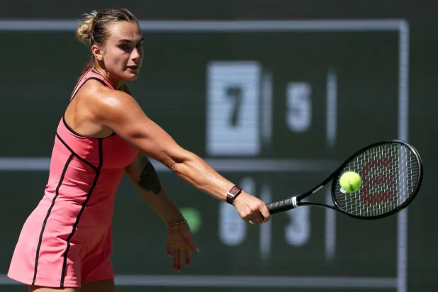 INDIAN WELLS, CALIFORNIA - MARCH 12: Aryna Sabalenka plays a backhand against Victoria Mboko of Canada in their quarterfinal match of the BNP Paribas Open at Indian Wells Tennis Garden on March 12, 2026 in Indian Wells, California. Clive Brunskill/Getty Images/AFP 