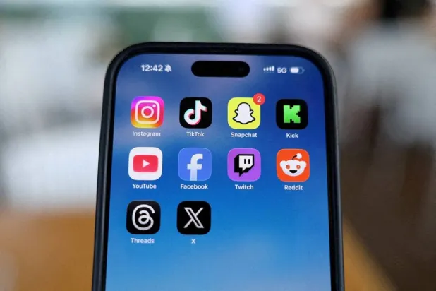  Instagram, TikTok, Snapchat, Kick, YouTube, Facebook, Twitch, Reddit, Threads and X applications are displayed on a mobile phone ahead of new law banning social media for users under 16 in Australia, in this picture illustration taken on December 9, 2025. (Reuters)
