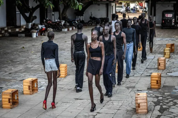 Professional models from the Juba-based modelling agency Jubalicious practice their catwalking during a modelling training session at a hotel in Juba on February 19, 2026.  (Photo by Luis TATO / AFP)