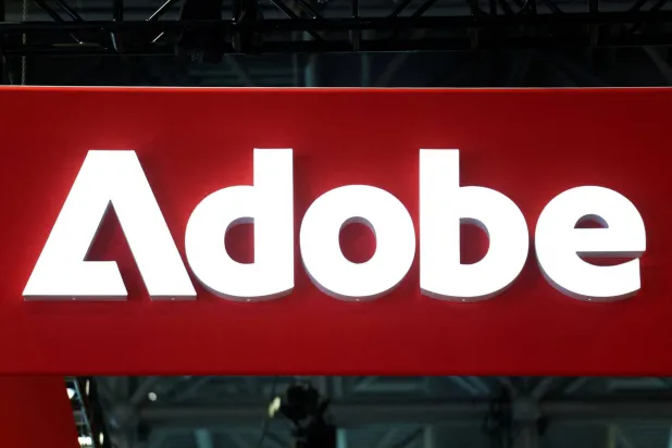 FILE PHOTO: Signage for Adobe is displayed at National Retail Federation (NRF) 2026: Retail's Big Show, in New York City, US, January 12, 2026. REUTERS/Kylie Cooper/File Photo