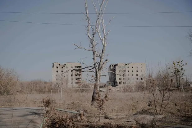 This photograph shows residential buildings heavily damaged by a Russian air strike at the beginning of the full-scale invasion, where more than 50 people were killed, in the center of the city of Izium, Kharkiv region on March 10, 2026, amid the Russian invasion of Ukraine. (AFP) 