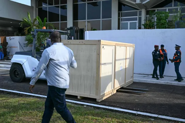 A crate containing the Djidji Ayokwe drum, at the airport in Abidjan, Ivory Coast. (Photo by Issouf SANOGO / AFP)