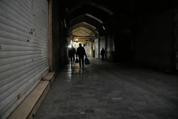  People walk past closed shops at the almost empty traditional main bazaar, in Tehran, Iran, Tuesday, March 10, 2026. (AP) 