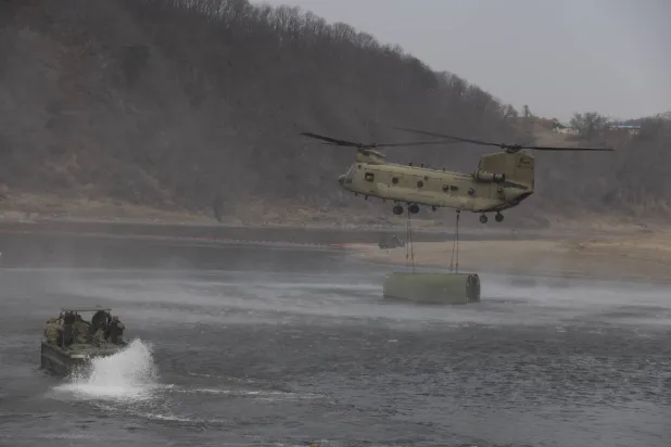 US soldiers from the 2nd Infantry Division/ROK-US Combined Division, conducts a combined exercise (maneuvering, wet gap crossing) with South Korean soldiers from the Lightning Brigade, Capital Mechanized Infantry Division and 7th Engineer Brigade, as part of the Freedom Shield 26 exercise, in Yeoncheon, Gyeonggi province, South Korea, 14 March 2026. EPA/JEON HEON-KYUN