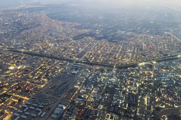 An aerial view shows Cairo's traffic with buildings and houses, through the window of a Turkish Airlines plane, in Cairo, Egypt March 12, 2026. REUTERS/Amr Abdallah Dalsh