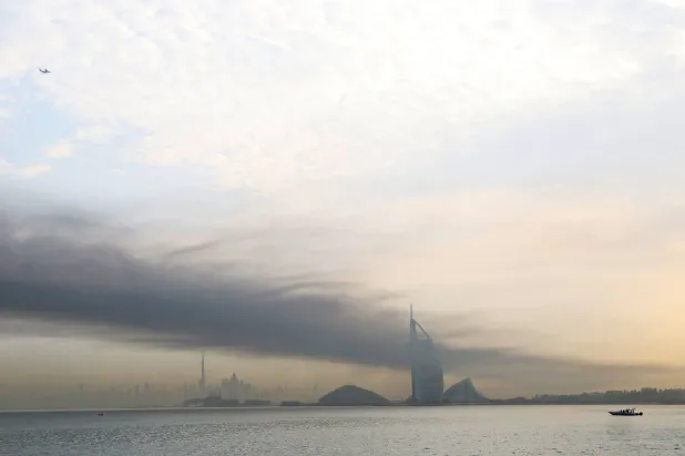 Smoke rises above Dubai on March 13, 2026. (AFP)