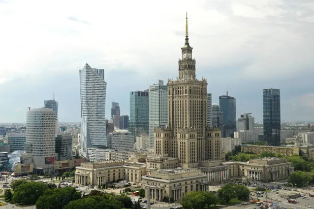 FILE - Newer skyscrapers flank the communist-era Palace of Culture and Science, foreground, in n, Poland, May 25, 2018. (AP Photo/Alik Keplicz, File)
