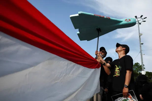 Protesters hold a mockup of Iranian-made drone Shahed-136, during a rally marking al-Quds Day (Jerusalem Day), amid the US-Israeli conflict with Iran, outside the U.S. Embassy in Jakarta, Indonesia, March 13, 2026. (EPA)