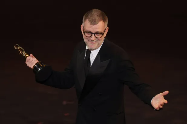 US filmmaker Paul Thomas Anderson accepts the Oscar for Best Writing (Adapted Screenplay) for "One Battle After Another" onstage during the 98th Annual Academy Awards at the Dolby Theater in Hollywood, California on March 15, 2026. (AFP) 