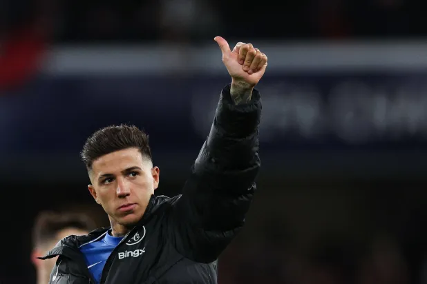 Chelsea's Argentinian midfielder #08 Enzo Fernandez gives a thumb up at the end of the UEFA Champions League round of 16 second leg football match between Chelsea FC and Paris Saint-Germain (PSG) at Stamford Bridge, west London on March 17, 2026. (Photo by Adrian Dennis / AFP)