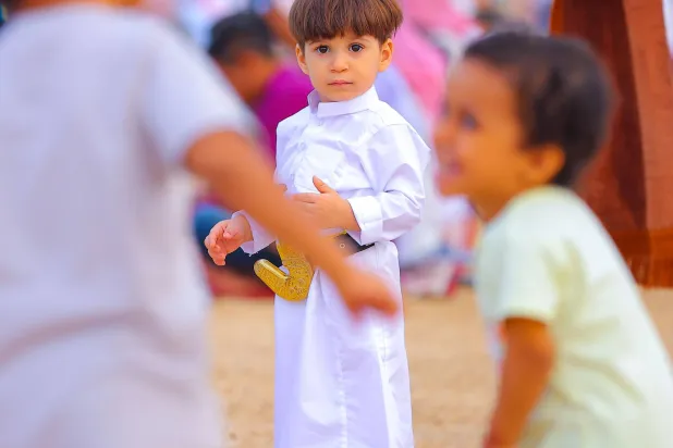 الأطفال أكثر افراد المجتمع فرائحية بالعيد – أرشيفية (تصوير: سعد الدوسري)