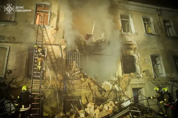 Rescuers work at the site of an apartment building hit by a Russian drone strike, amid Russia's attack on Ukraine, in Odesa, Ukraine in this handout picture released March 19, 2026. (Press service of the State Emergency Service of Ukraine in Odesa region/Handout via Reuters)