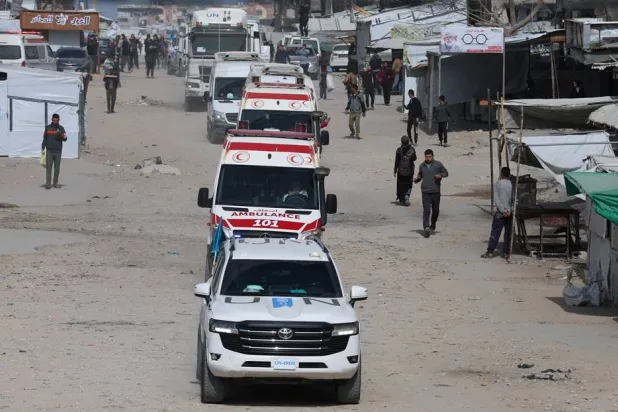 A UN vehicle leads ambulances carrying war-wounded people and patients who leave Gaza, for treatment abroad, through the Rafah border crossing between Gaza and Egypt after it was opened by Israel on Thursday for a limited number of people, in Khan Younis in the southern Gaza Strip, March 19, 2026. (Reuters) 