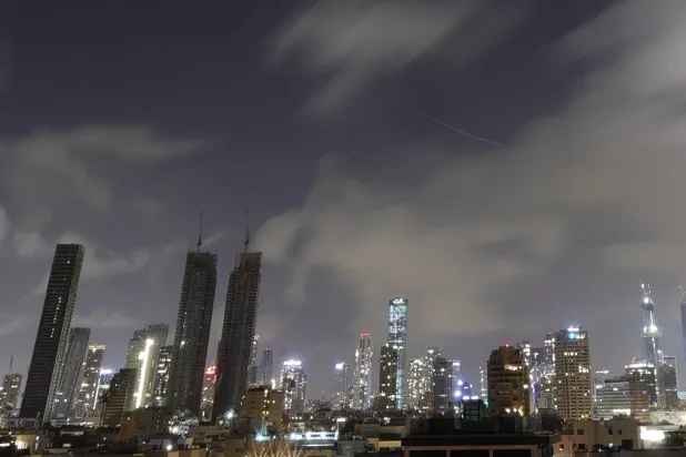 A long exposure showing the interception of a ballistic missile in the skies above Tel Aviv, as sirens sounds across central Israel, 20 March  2026. EPA/ABIR SULTAN