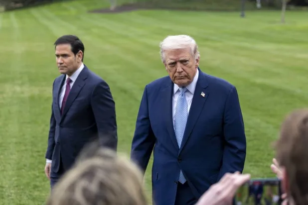 US President Donald Trump (R), with Secretary of State Marco Rubio (L), responds to a question from the news media as he walks to board Marine One on the South Lawn of the White House in Washington, DC, USA, 20 March 2026. (EPA)